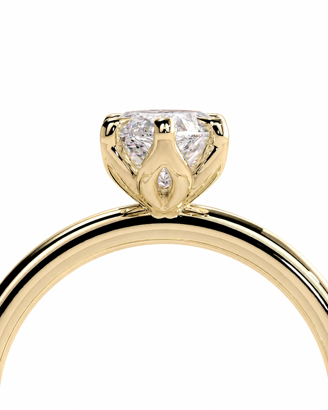 color_10K_YG, color_14K_YG &&A close-up of a yellow gold ring featuring a heart-shaped diamond solitaire setting with a small marquise-cut diamond accent, shown on a plain white background.