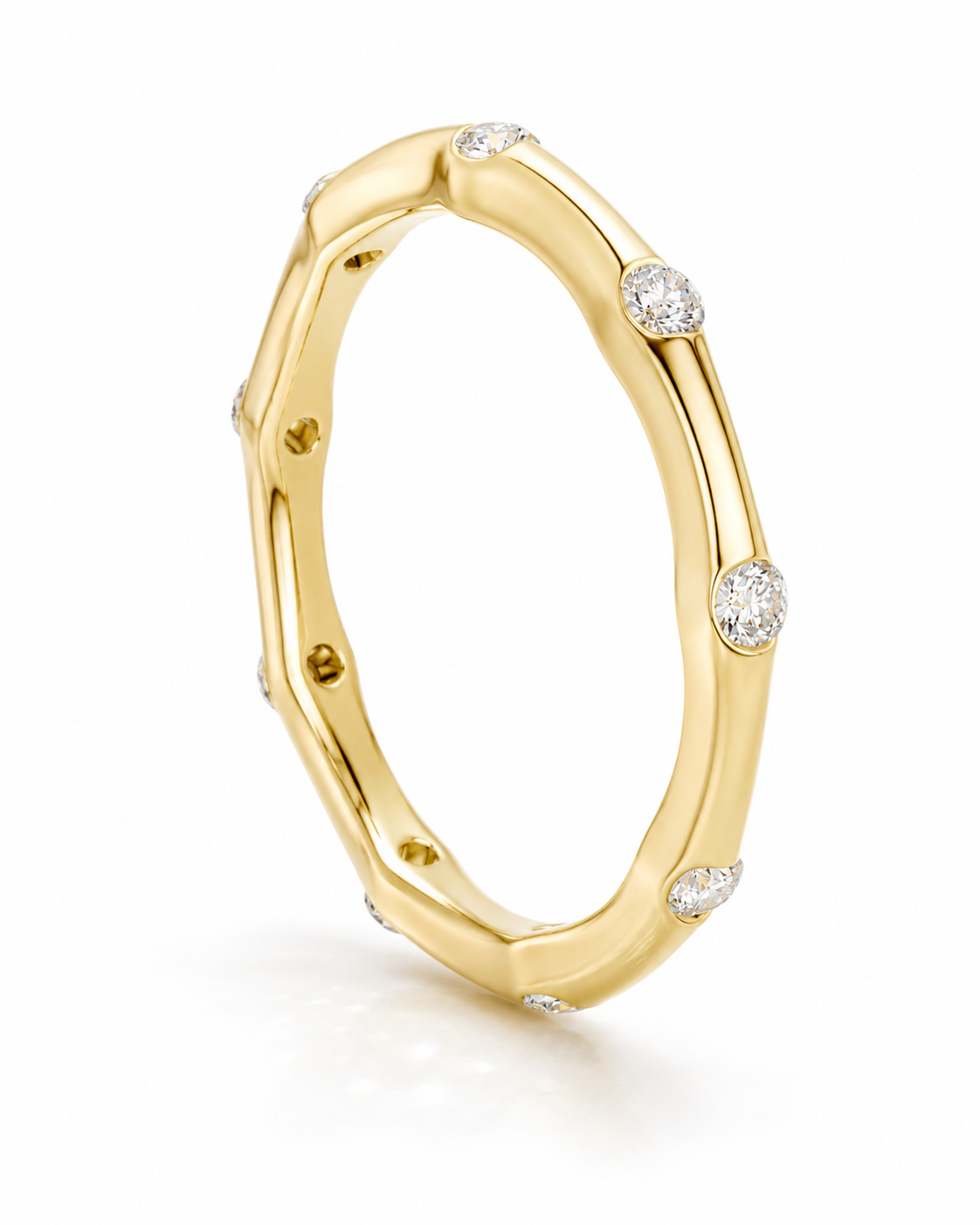 color_10K_YG, color_14K_YG &&	
Minimalist moissanite wedding band showcasing flush-style round stone placement.