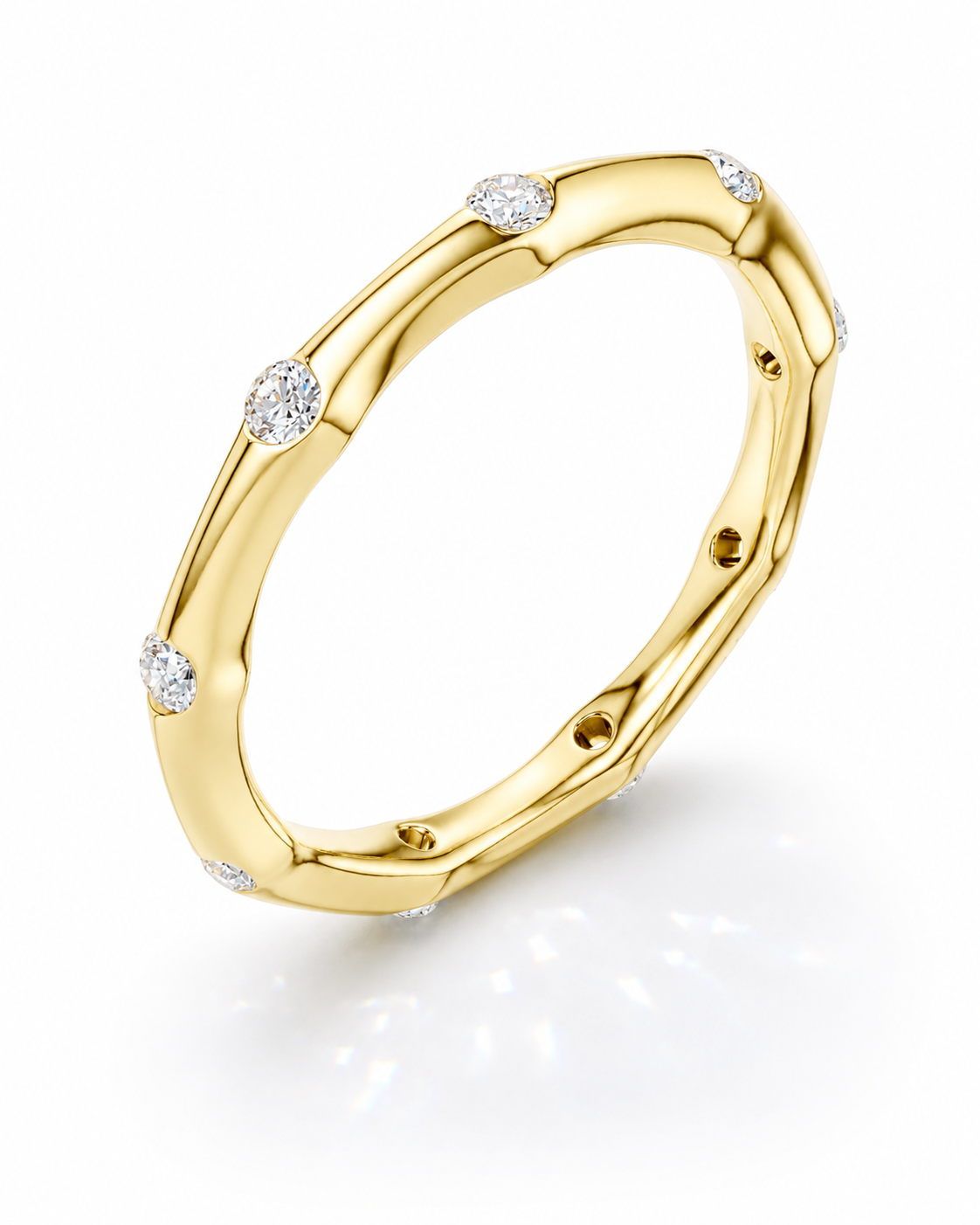 color_10K_YG, color_14K_YG &&	
Close-up of a handcrafted wedding ring with bezel-set round moissanite stones.