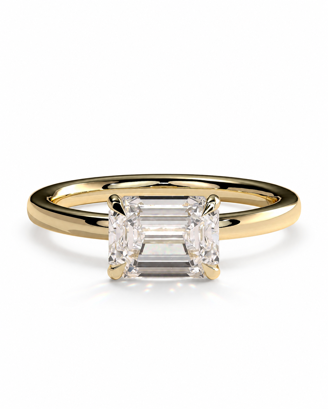color_10K_YG, color_14K_YG &&A yellow gold solitaire engagement ring featuring a rectangular baguette-cut diamond center stone, set against a clean white background.