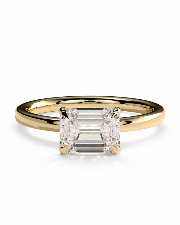 color_10K_YG, color_14K_YG &&A yellow gold solitaire engagement ring featuring a rectangular baguette-cut diamond center stone, set against a clean white background.