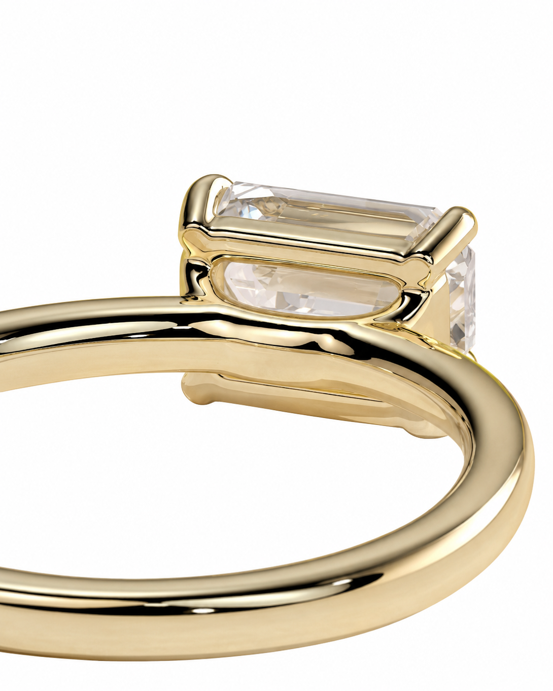 color_10K_YG, color_14K_YG &&A close-up shot of a yellow gold ring featuring a rectangular baguette-cut clear gemstone in a prong setting, shown against a solid white background.