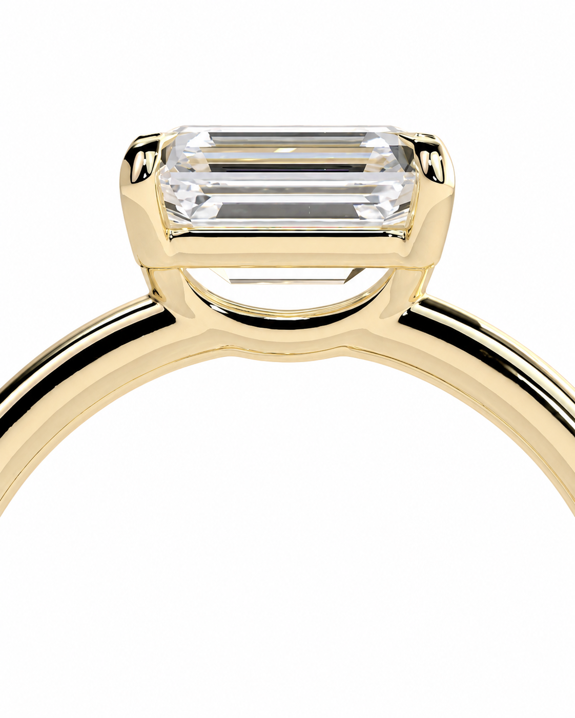 color_10K_YG, color_14K_YG &&Close-up of a yellow gold ring with a rectangular baguette-cut clear gemstone in a four-prong setting, shown against a plain white background.