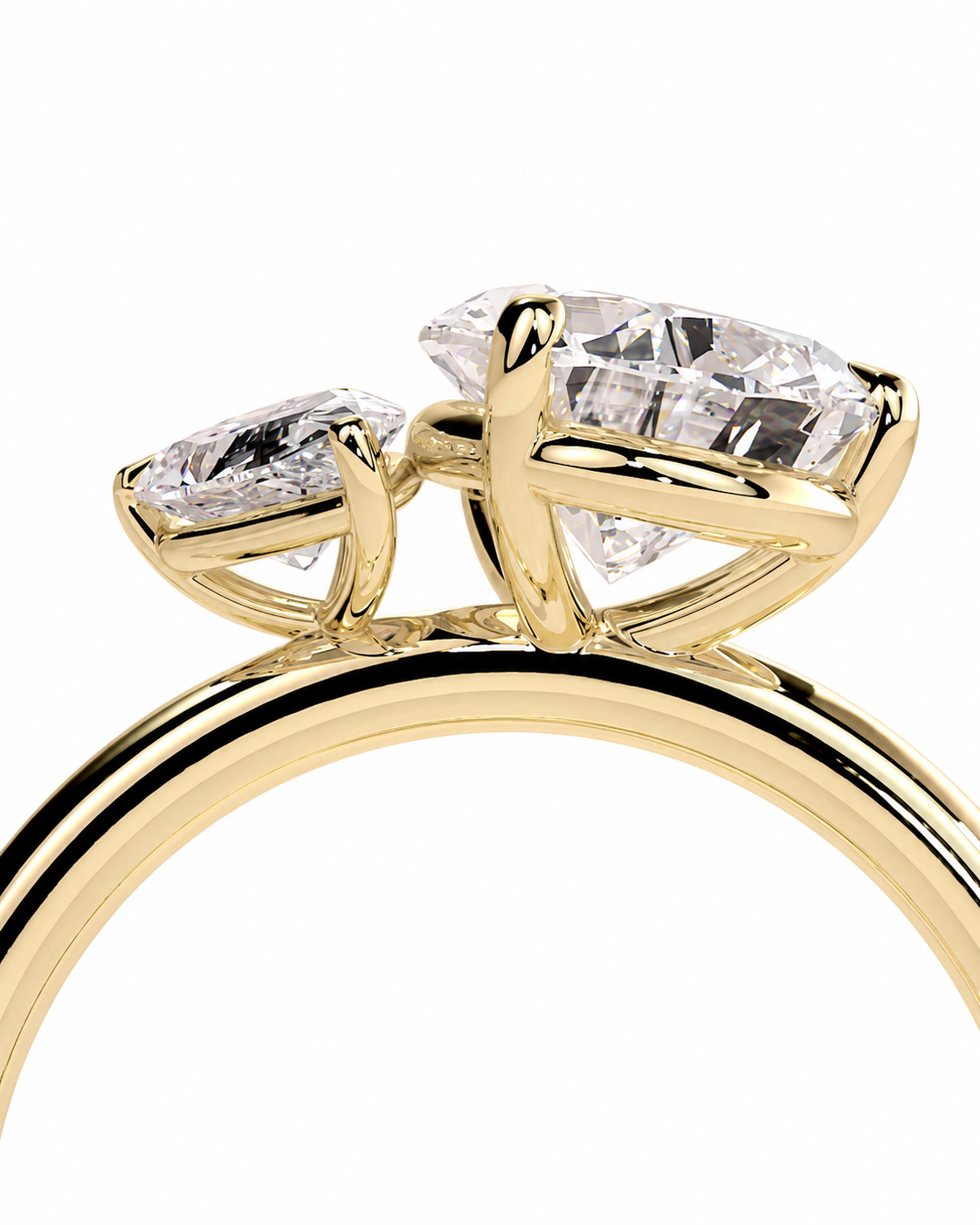 color_10K_YG, color_14K_YG &&A close-up of a yellow gold ring featuring two marquise-cut clear gemstones in a split setting, shown against a plain white background.