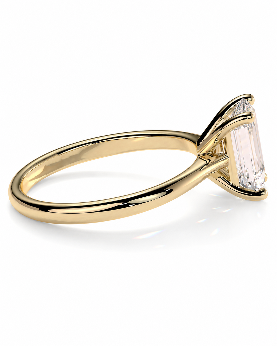 color_10K_YG, color_14K_YG &&A yellow gold solitaire engagement ring featuring a baguette-cut clear gemstone in a prong setting, shown on a clean white background.