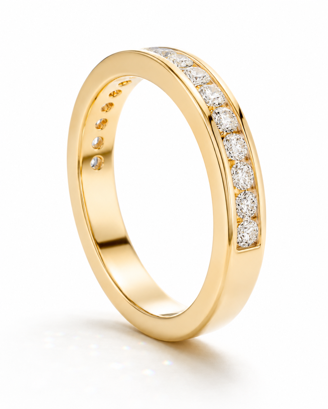color_10K_YG, color_14K_YG &&	
Modern moissanite anniversary band with round stones securely channel set.