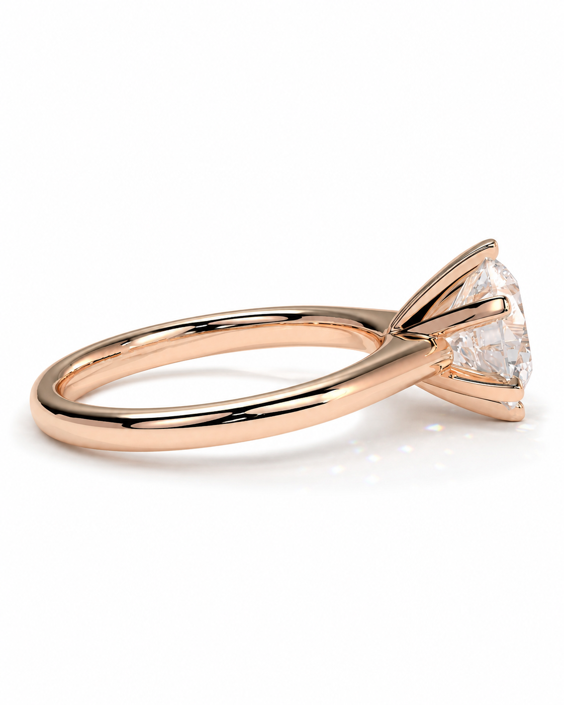 color_10K_RG, color_14K_RG &&A rose gold solitaire engagement ring featuring a triangular-cut clear gemstone in a prong setting, shown on a clean white background.