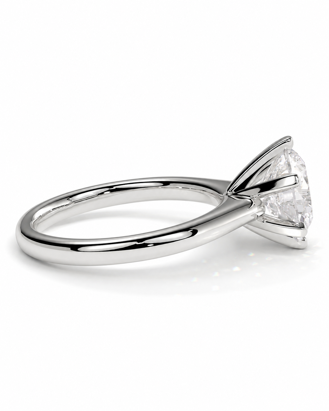 color_925_SIL,color_935_ARG,color_10K_WG, color_14K_WG &&A classic solitaire engagement ring featuring a round brilliant-cut diamond set in a polished silver-colored metal band, shown from a side profile view on a clean white background.
