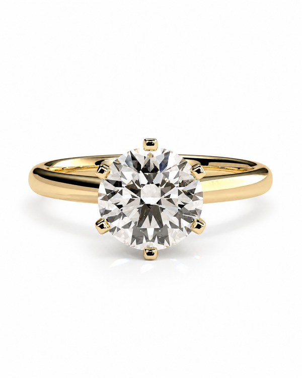 color_10K_YG, color_14K_YG &&A classic solitaire engagement ring featuring a round brilliant-cut diamond set in a yellow gold four-prong band, shown on a clean white background.