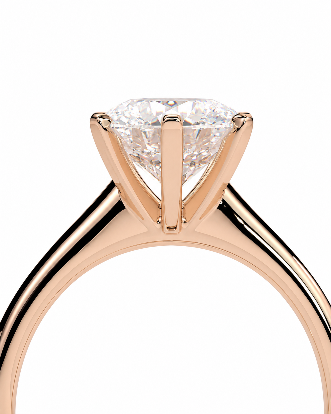 color_10K_RG, color_14K_RG &&A close-up studio shot of a rose gold solitaire engagement ring with a round brilliant-cut diamond on a clean white background.