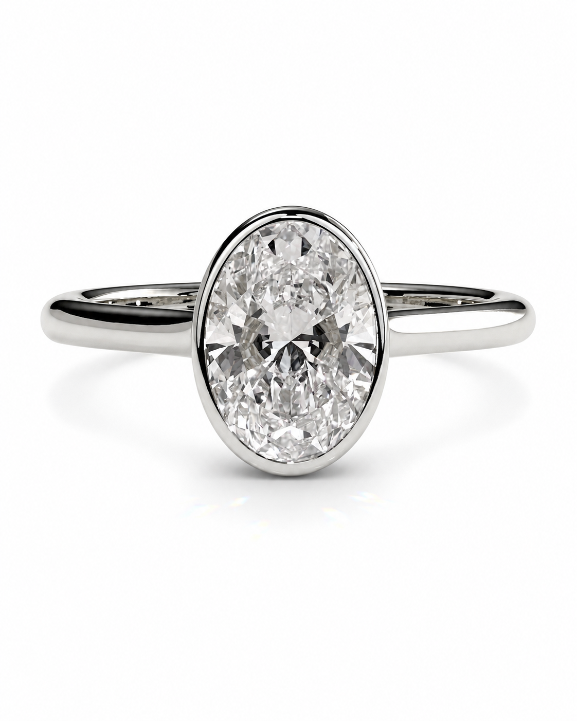 color_925_SIL,color_935_ARG,color_10K_WG, color_14K_WG &&An oval-cut diamond engagement ring with a polished silver-colored band, set against a clean white background.
