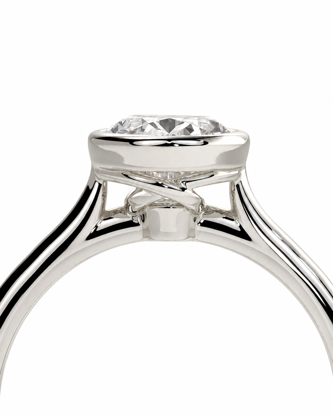 color_925_SIL,color_935_ARG,color_10K_WG, color_14K_WG &&A close-up studio shot of a silver-toned ring with a clear round gemstone in a prong setting, shown against a plain white background.