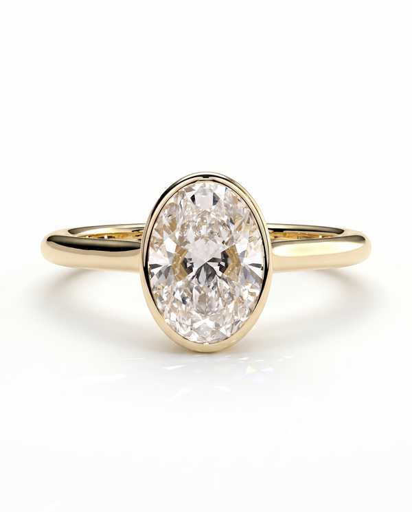 color_10K_YG, color_14K_YG &&A yellow gold ring featuring a large oval-cut clear gemstone in a bezel setting, shown on a clean white background with a soft reflection.