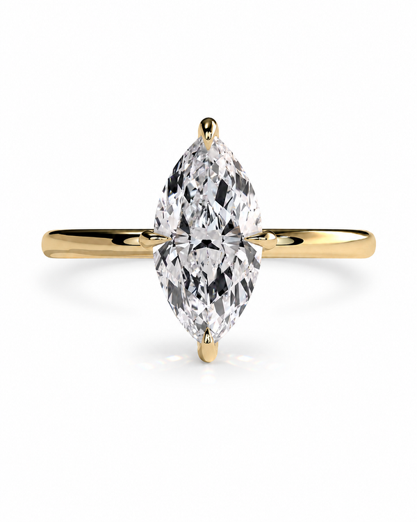 color_10K_YG, color_14K_YG &&A yellow gold ring featuring a large marquise-cut clear gemstone in a four-prong setting, centered on a clean white background.