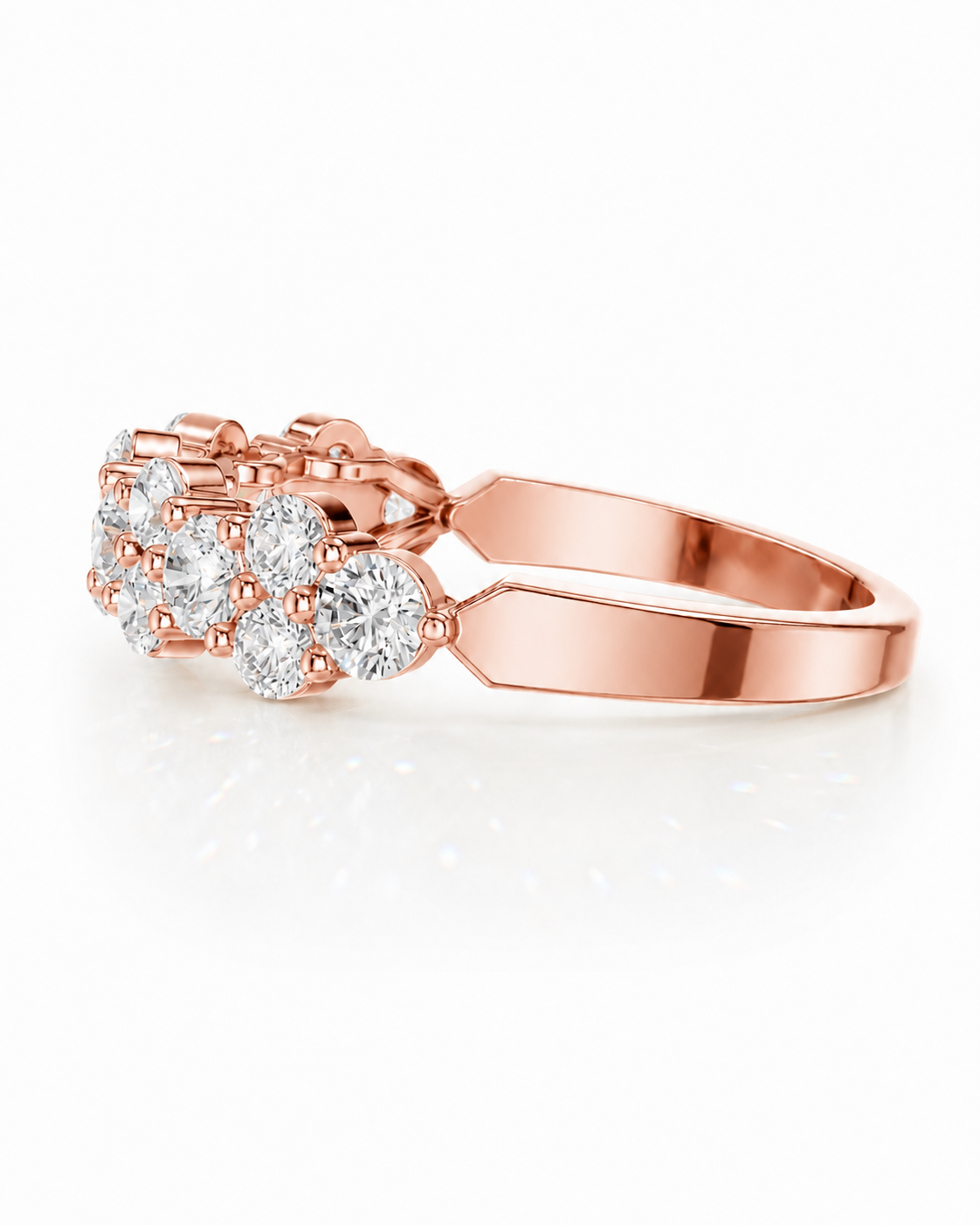 color_10K_RG, color_14K_RG &&	
A rose gold cluster ring featuring a central round diamond surrounded by smaller round and oval diamonds, set on a polished band, shown on a clean white background.