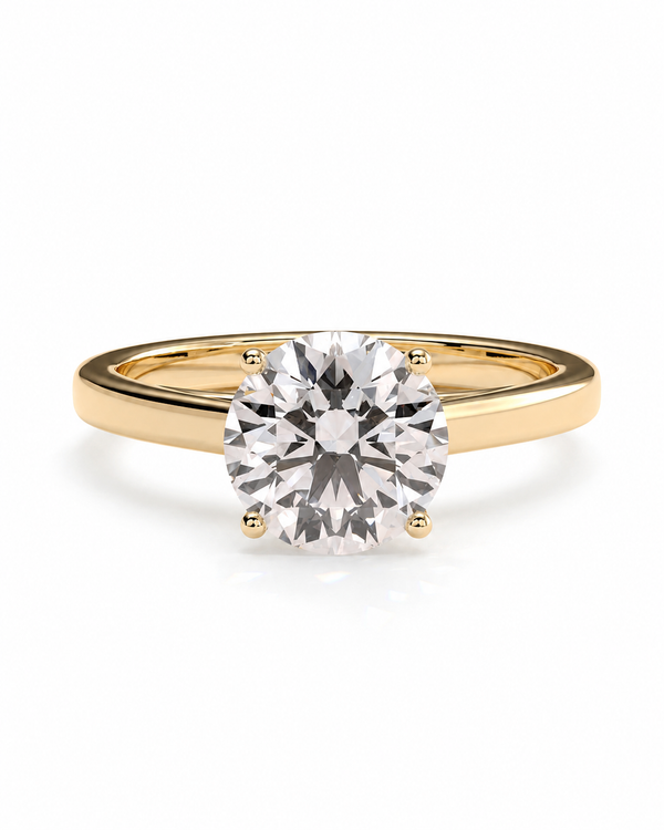 color_10K_YG, color_14K_YG &&A classic solitaire engagement ring featuring a round brilliant-cut diamond set in a yellow gold four-prong band, shown on a clean white background.