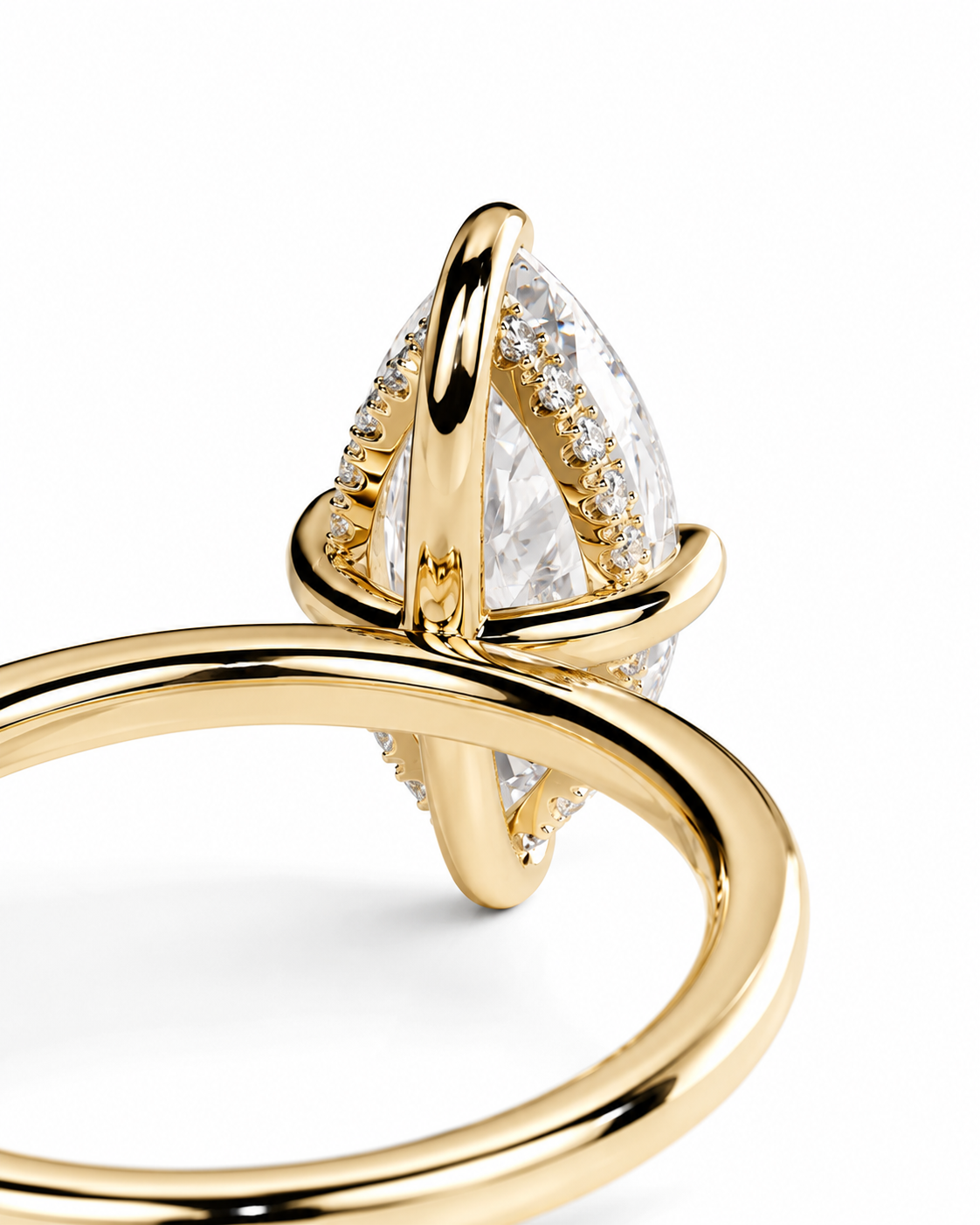 color_10K_YG, color_14K_YG &&A close-up of a gold ring featuring a large marquise-cut clear gemstone surrounded by small pavé-set clear stones, on a clean white background.