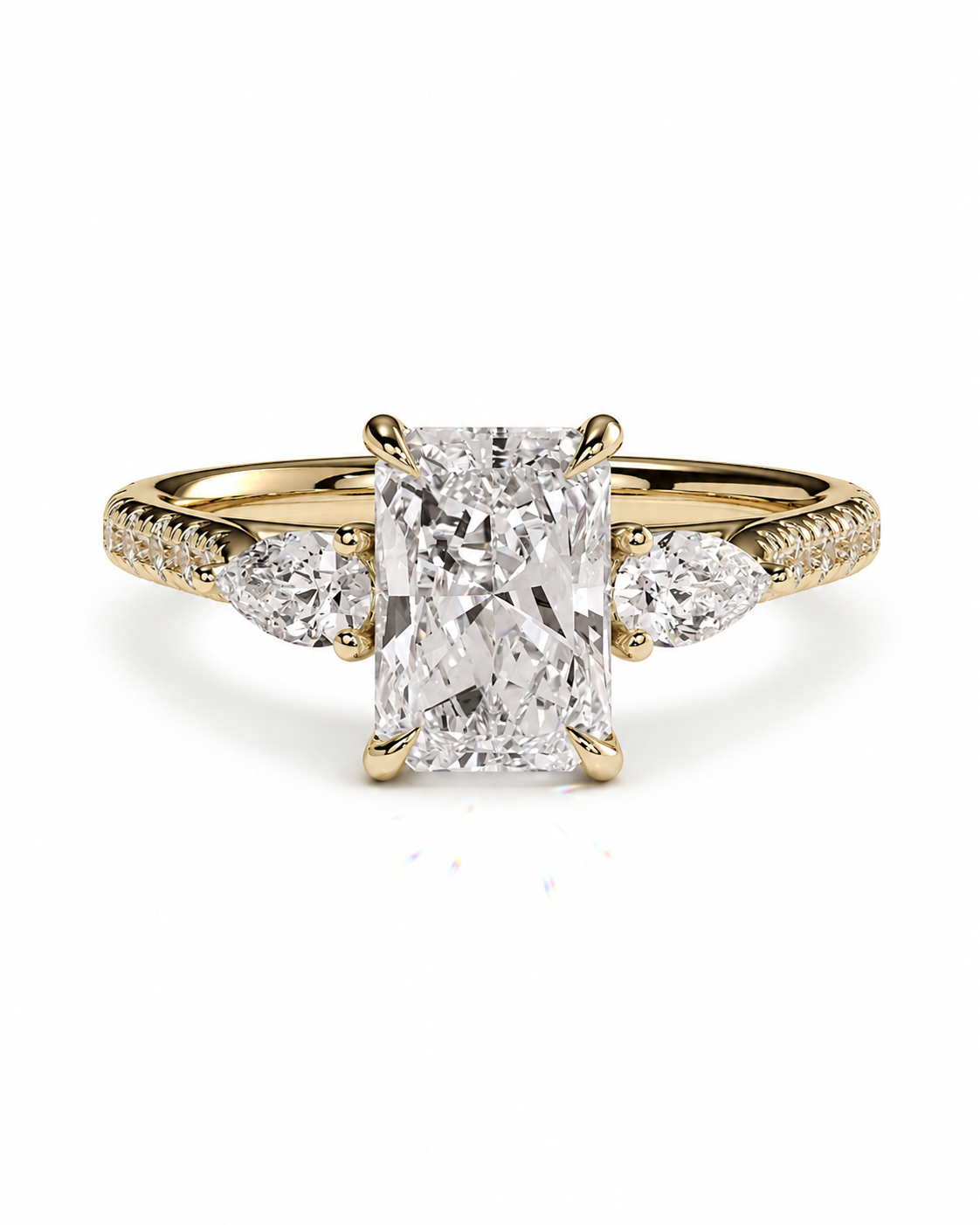 color_10K_YG, color_14K_YG &&A yellow gold diamond ring with a large rectangular center stone and smaller round and marquise side stones, set against a plain white background.