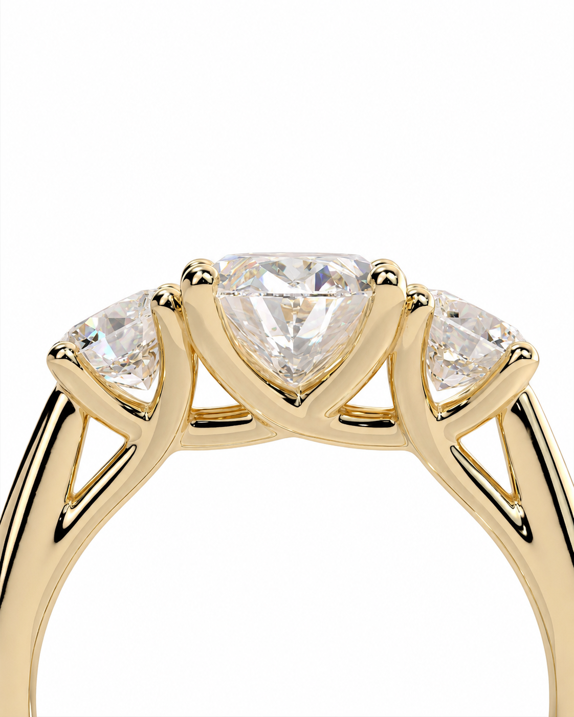 color_10K_YG, color_14K_YG &&A close-up of a yellow gold ring featuring a central heart-shaped clear gemstone flanked by two smaller marquise-cut clear gemstones, set against a plain white background.
