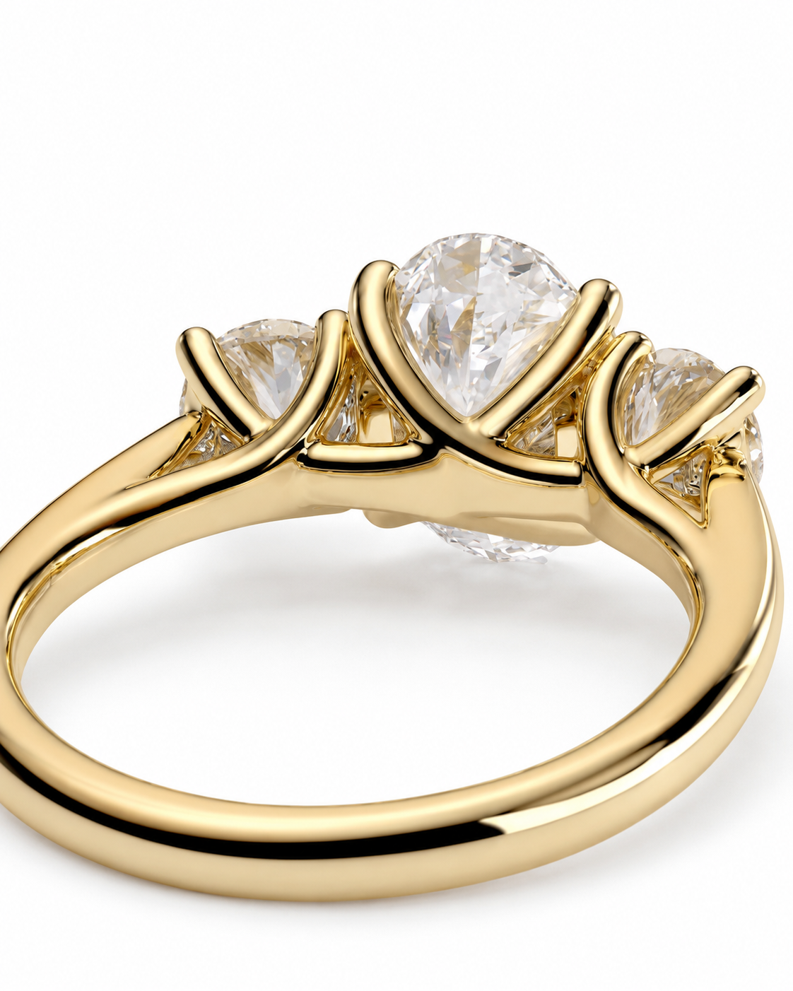color_10K_YG, color_14K_YG &&A yellow gold three-stone diamond ring with a large oval center stone and two smaller round side stones, shown on a clean white background.