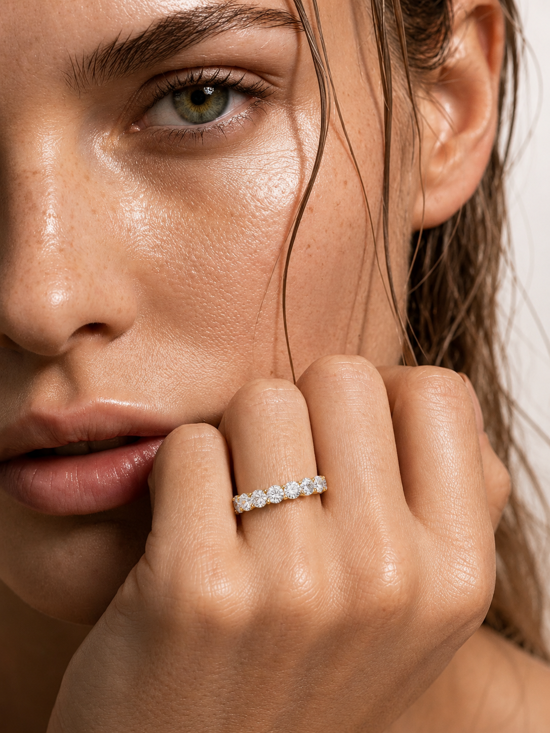 color_10K_YG, color_14K_YG &&Round moissanite full eternity wedding band captured from an angled view.