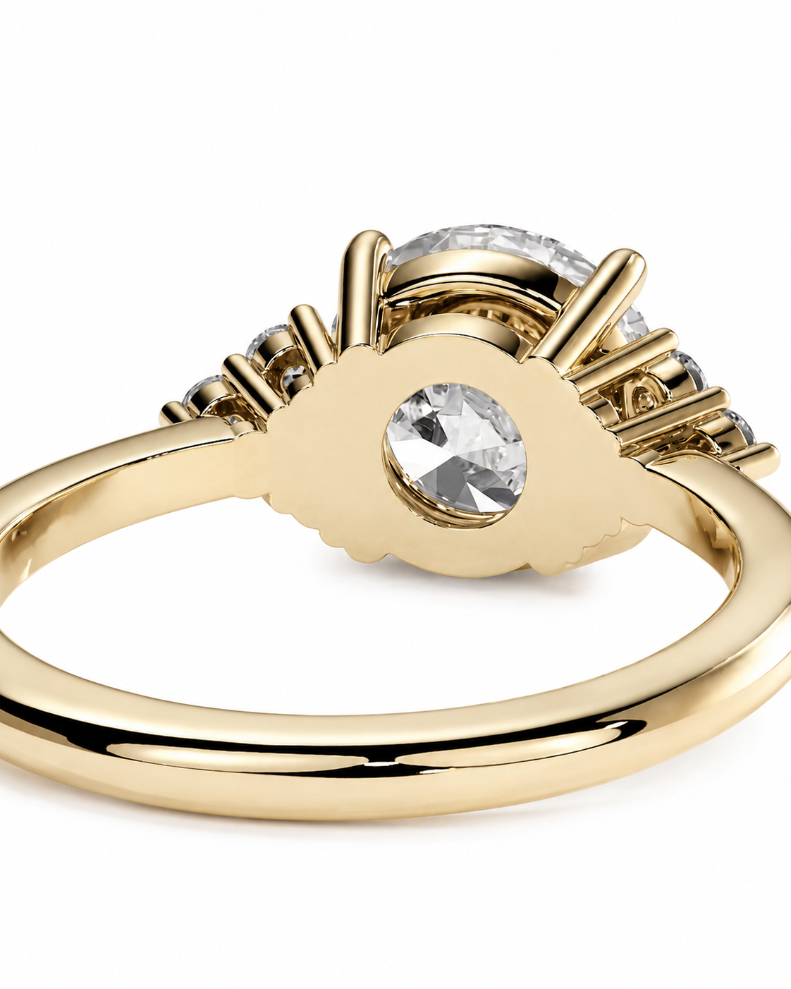 color_10K_YG, color_14K_YG &&A close-up shot of a yellow gold ring with a scalloped halo setting, featuring a round clear center stone and smaller side stones, set against a plain white background.