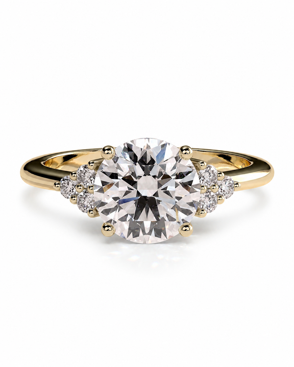 color_10K_YG, color_14K_YG &&A yellow gold engagement ring featuring a large round brilliant-cut center stone, accented by small round stones on either side of the band, set against a clean white background.