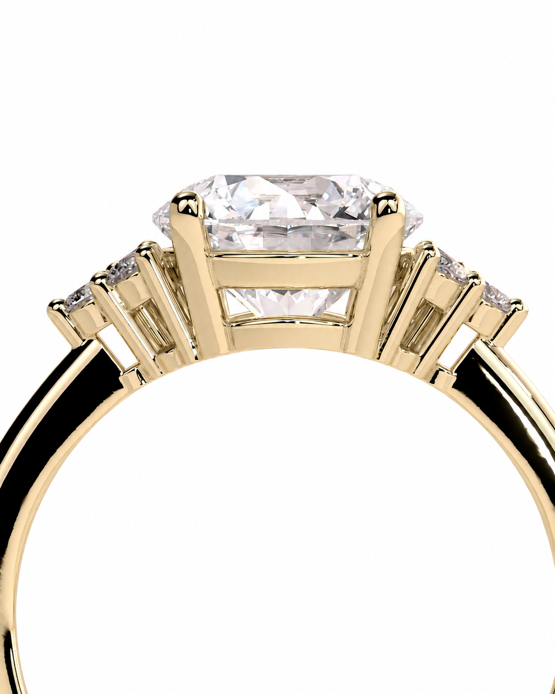 color_10K_YG, color_14K_YG &&A close-up of a yellow gold ring featuring a large rectangular clear center stone with smaller side stones, shown on a plain white background.