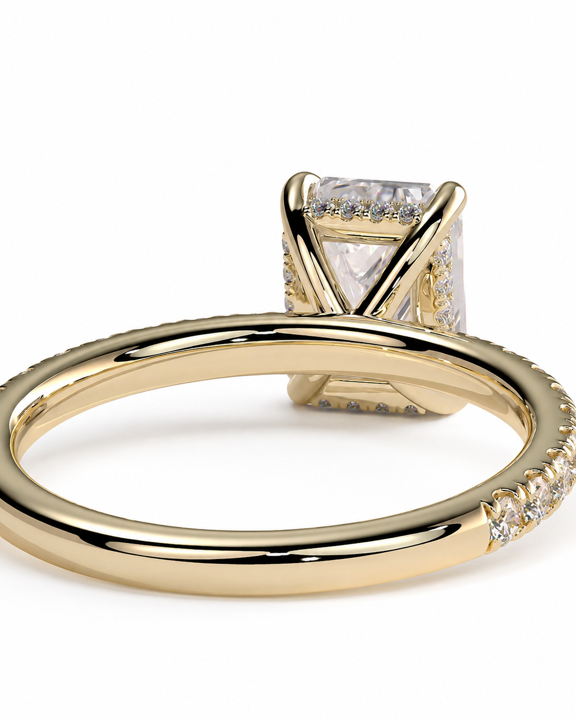 color_10K_YG, color_14K_YG &&A yellow gold ring with a square clear gemstone in a prong setting, accented with small pavé diamonds along the band, shown on a white background.