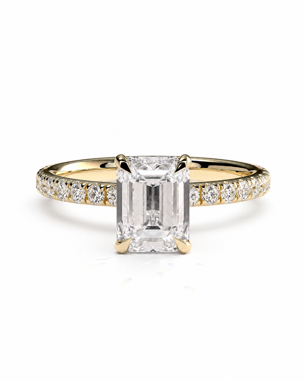 color_10K_YG, color_14K_YG &&A yellow gold engagement ring featuring a large emerald-cut clear center stone and a pavé band with small diamonds, set against a plain white background.