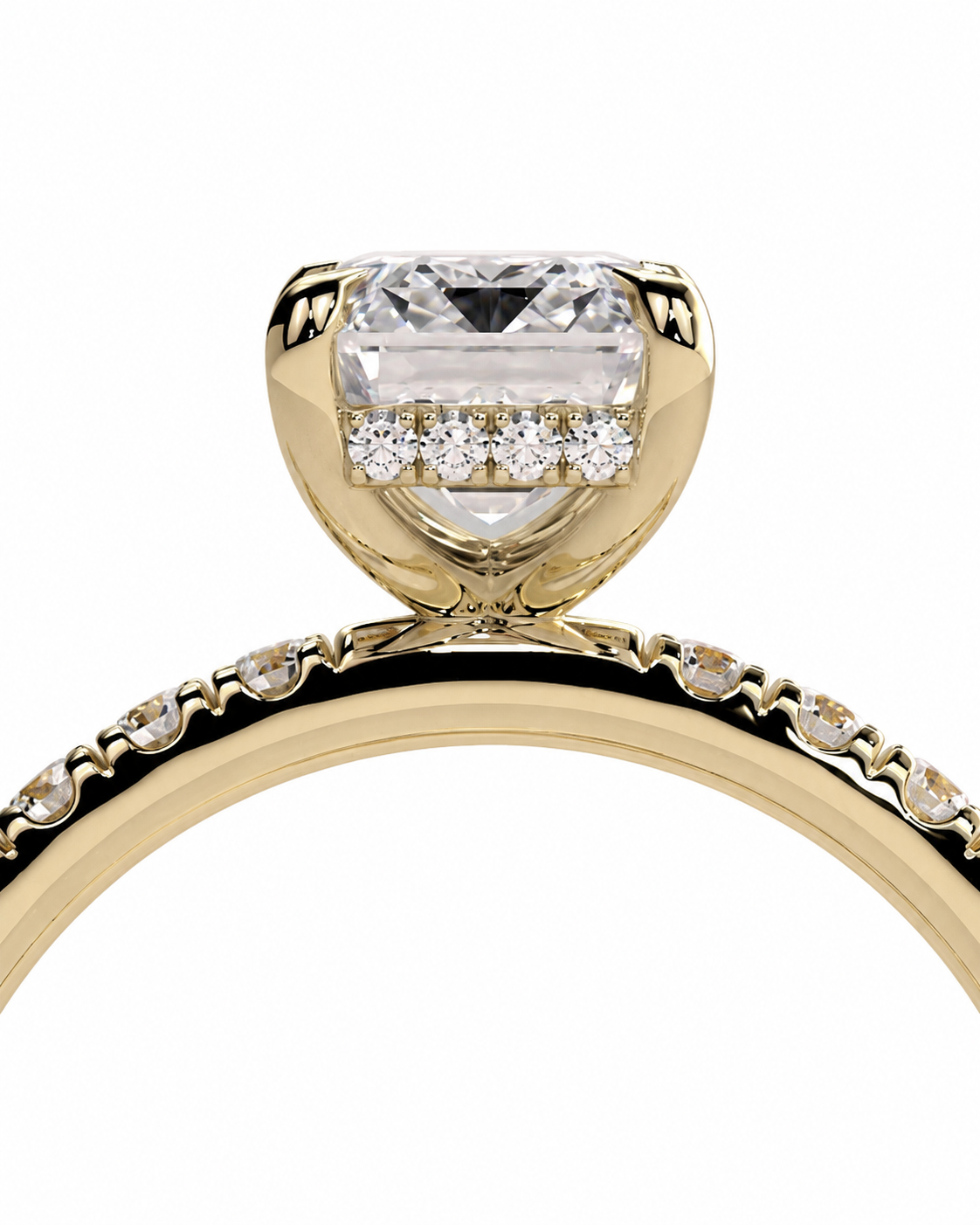 color_10K_YG, color_14K_YG &&A close-up of a yellow gold engagement ring featuring a large rectangular clear center stone and smaller diamonds along the band, set against a plain white background.