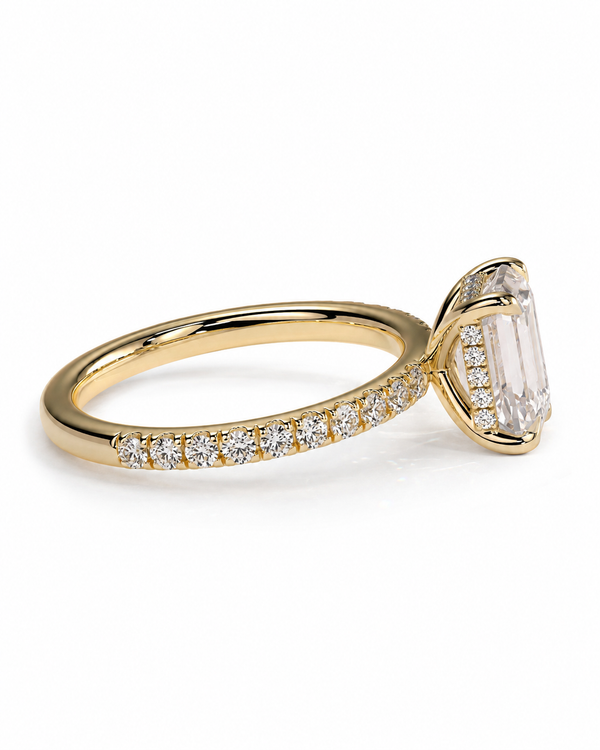 color_10K_YG, color_14K_YG &&A yellow gold ring featuring a large rectangular clear gemstone in a prong setting, with a pavé band of small round diamonds, shown on a white background.