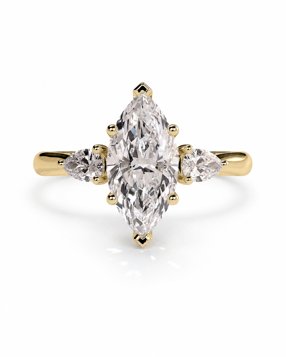 color_10K_YG, color_14K_YG &&A yellow gold ring featuring a marquise-cut clear center stone with two smaller marquise-cut side stones, set against a clean white background.