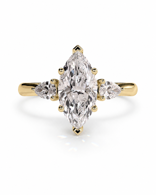 color_10K_YG, color_14K_YG &&A yellow gold ring featuring a marquise-cut clear center stone with two smaller marquise-cut side stones, set against a clean white background.
