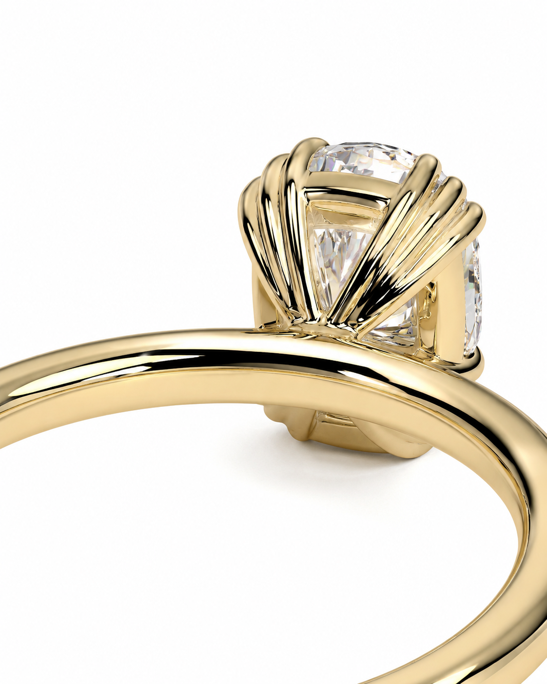 color_10K_YG, color_14K_YG &&A close-up shot of a yellow gold ring featuring a bezel-set clear cushion-cut gemstone, shown against a plain white background.