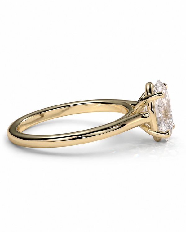 color_10K_YG, color_14K_YG &&A yellow gold solitaire engagement ring featuring an emerald-cut diamond, shown in a three-quarter side view on a clean white background.