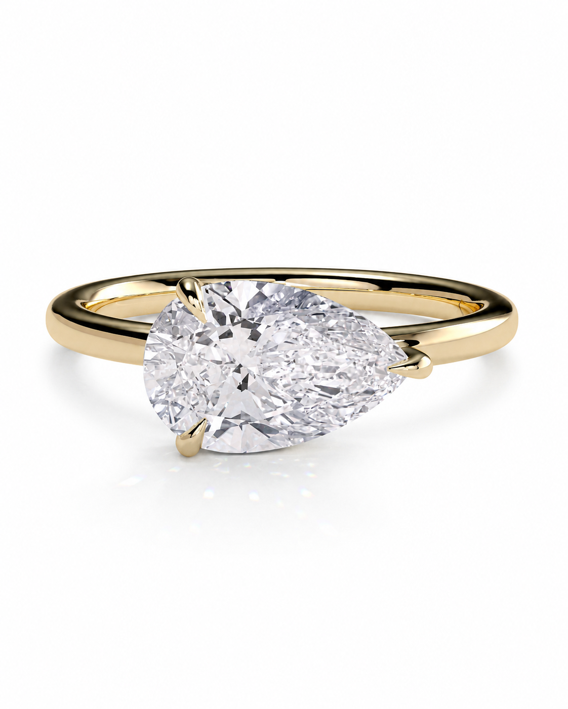 color_10K_YG, color_14K_YG &&
A pear-cut diamond solitaire engagement ring set in a yellow gold band, shown on a clean white background.