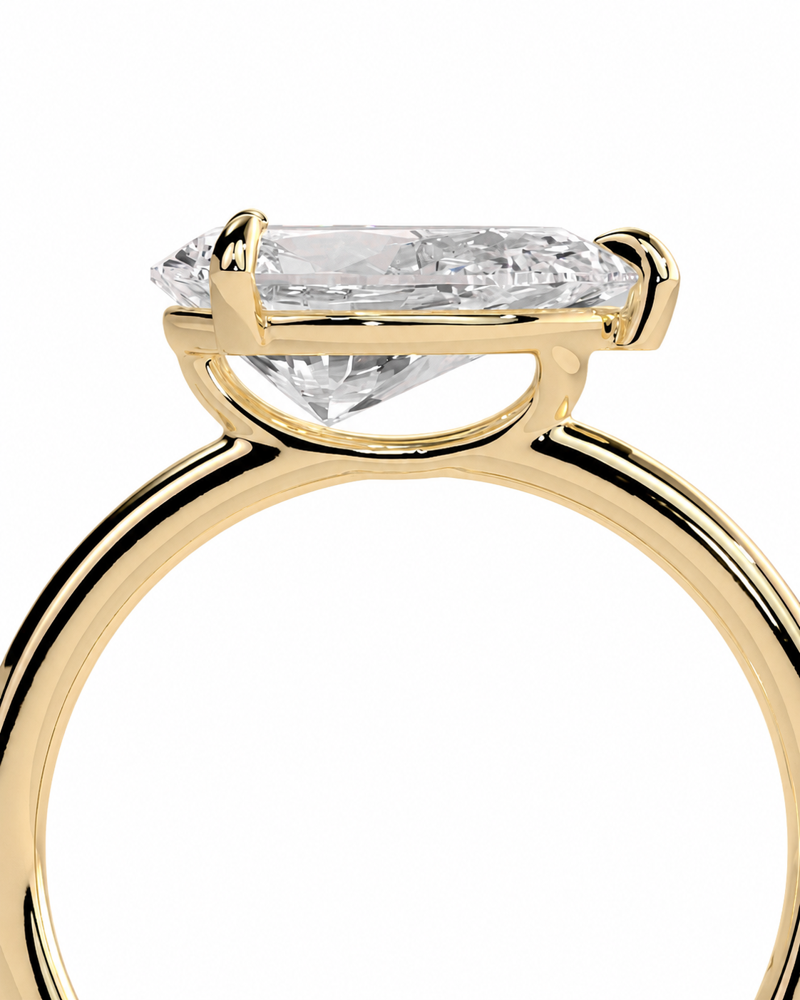 color_10K_YG, color_14K_YG &&
A close-up of a yellow gold ring setting with a clear marquise-cut gemstone, shown against a plain white background.