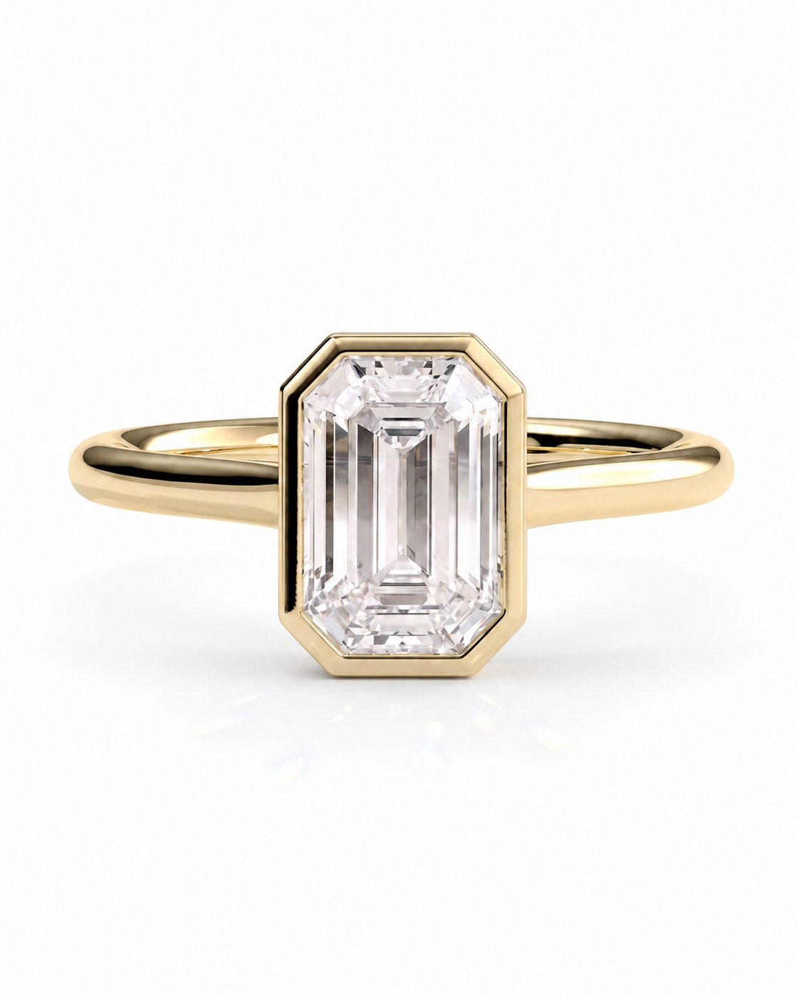 color_10K_YG, color_14K_YG &&A yellow gold ring featuring an emerald-cut clear gemstone in a bezel setting, shown against a clean white background.