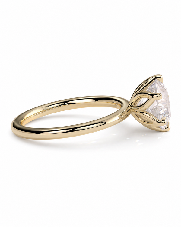 color_10K_YG, color_14K_YG &&A yellow gold solitaire engagement ring with a clear marquise-cut gemstone in a prong setting, shown on a clean white background.