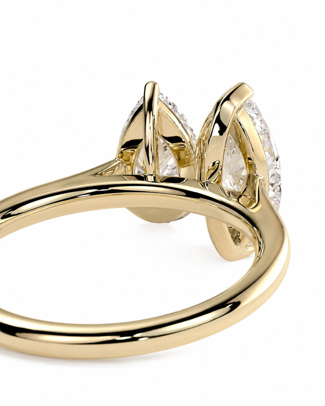 color_10K_YG, color_14K_YG &&A close-up shot of a yellow gold ring featuring three marquise-cut clear gemstones in a prong setting, shown on a clean white background.