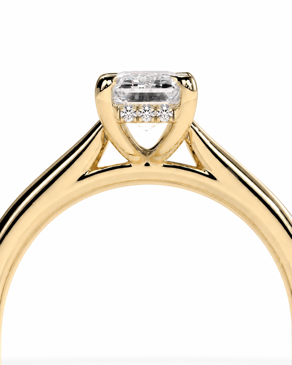 color_10K_YG, color_14K_YG &&A close-up of a yellow gold diamond ring with a large rectangular emerald-cut center stone and smaller diamonds along the halo, set against a plain white background.
