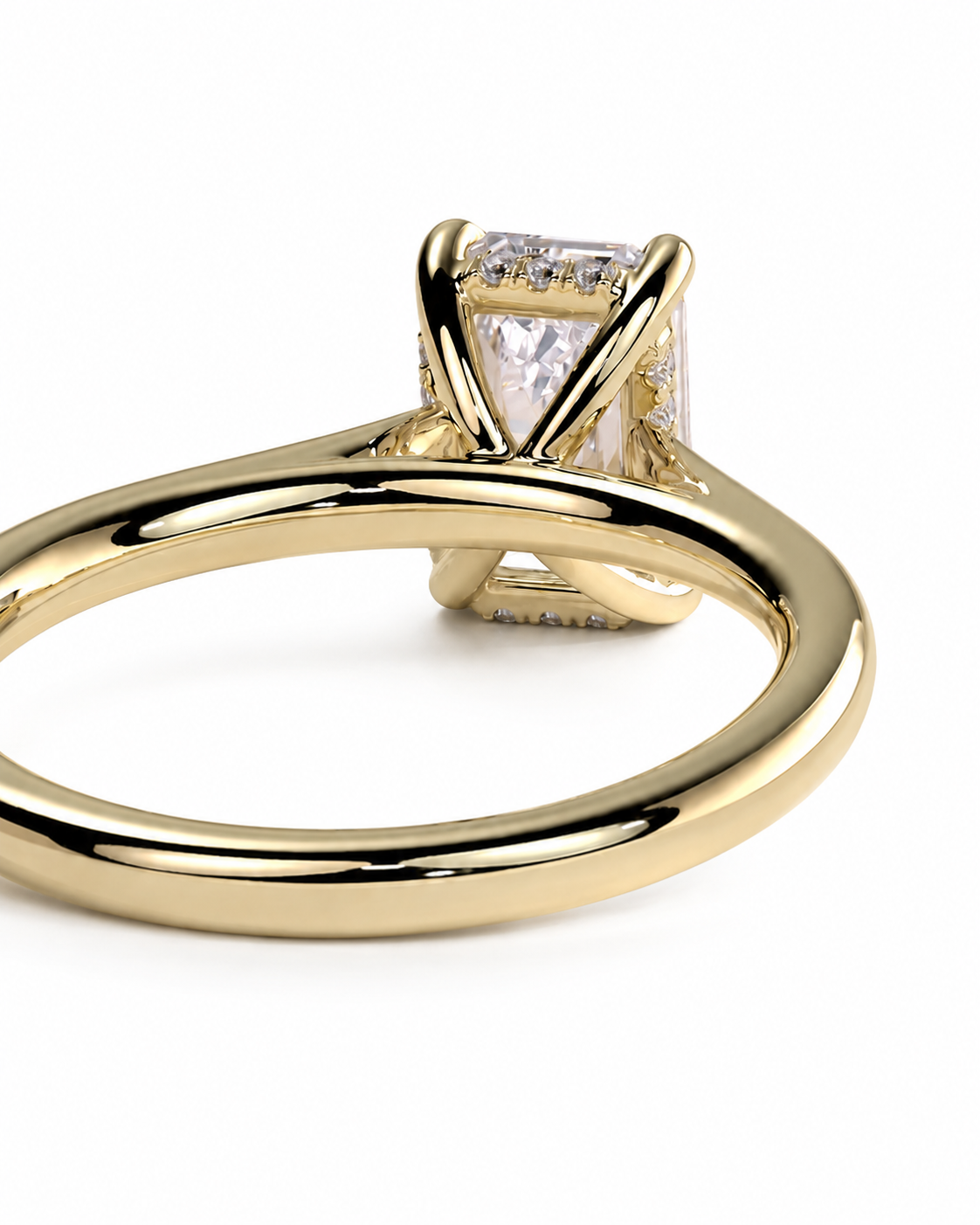 color_10K_YG, color_14K_YG &&A close-up shot of a yellow gold solitaire ring featuring a square radiant-cut clear gemstone in a four-prong setting, shown on a plain white background.