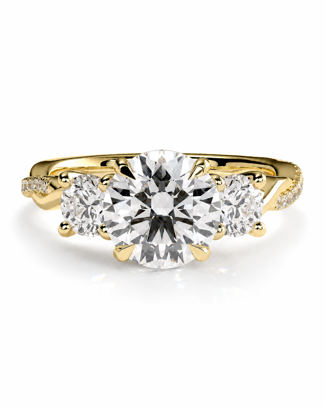 color_10K_YG, color_14K_YG &&A yellow gold three-stone diamond engagement ring with a large round center diamond and two smaller round side diamonds, set against a clean white background.