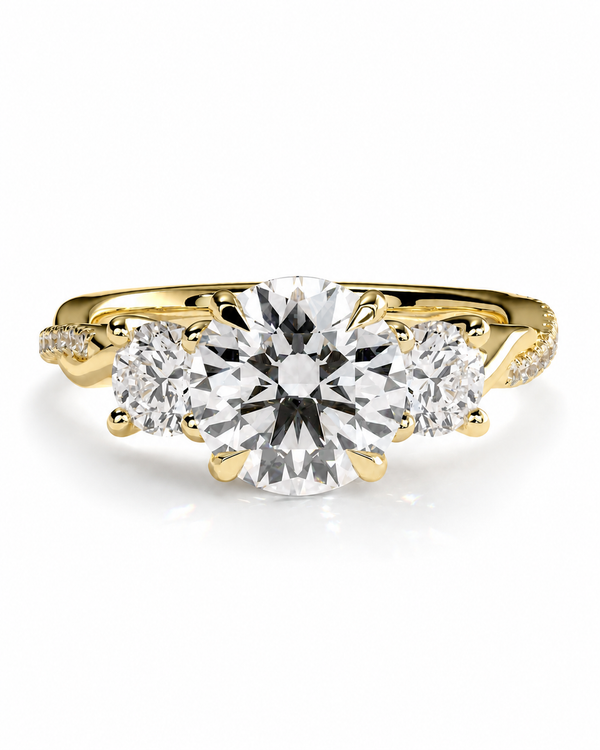 color_10K_YG, color_14K_YG &&A yellow gold three-stone diamond engagement ring with a large round center diamond and two smaller round side diamonds, set against a clean white background.