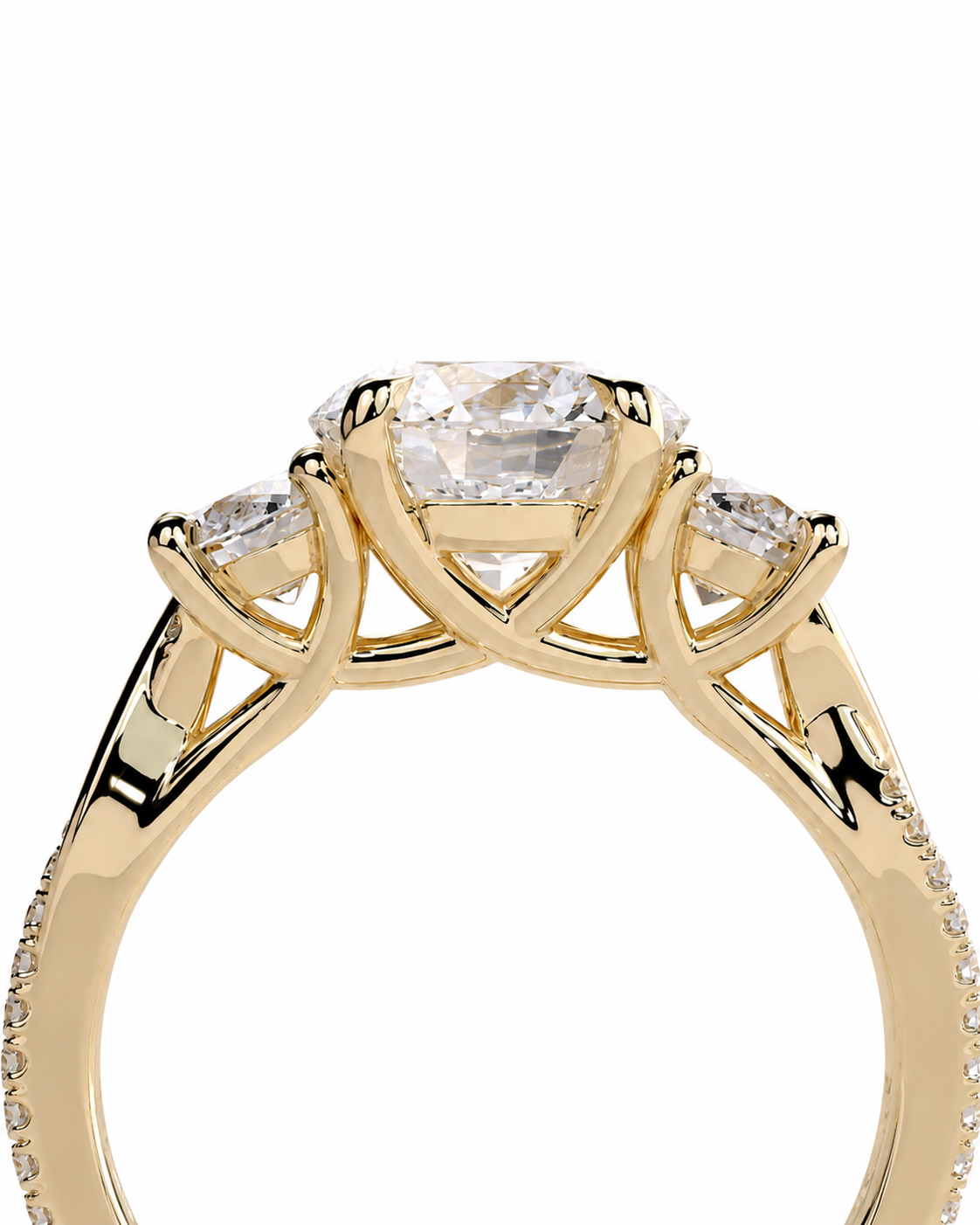 color_10K_YG, color_14K_YG &&A close-up of a yellow gold ring with a large cushion-cut center diamond and two smaller round diamonds on the shoulders, set against a plain white background.