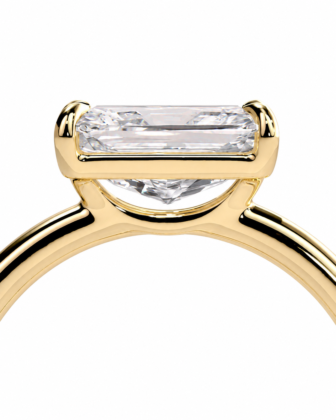 color_10K_YG, color_14K_YG &&
Close-up of a yellow gold ring setting with a rectangular baguette-cut clear gemstone on a white background.
