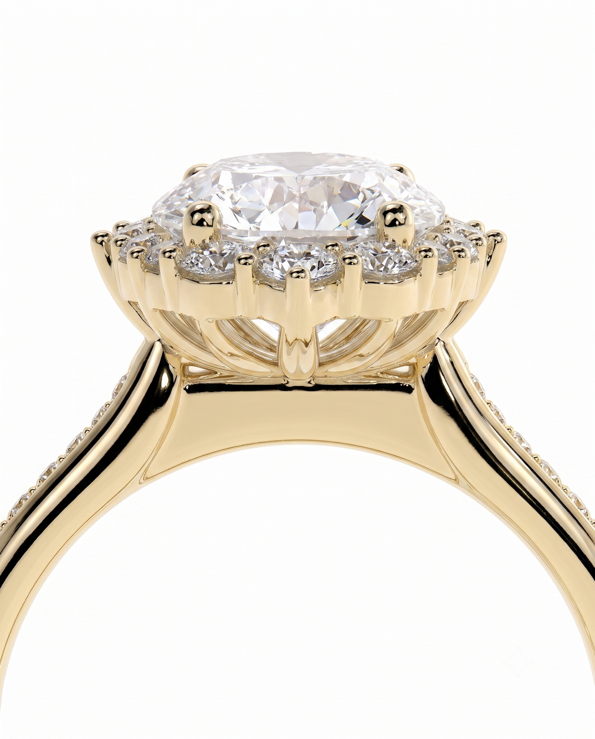 color_10K_YG, color_14K_YG &&A close-up of a yellow gold ring featuring a large oval-cut clear center stone surrounded by a halo of smaller round stones, set on a polished gold band against a white background.