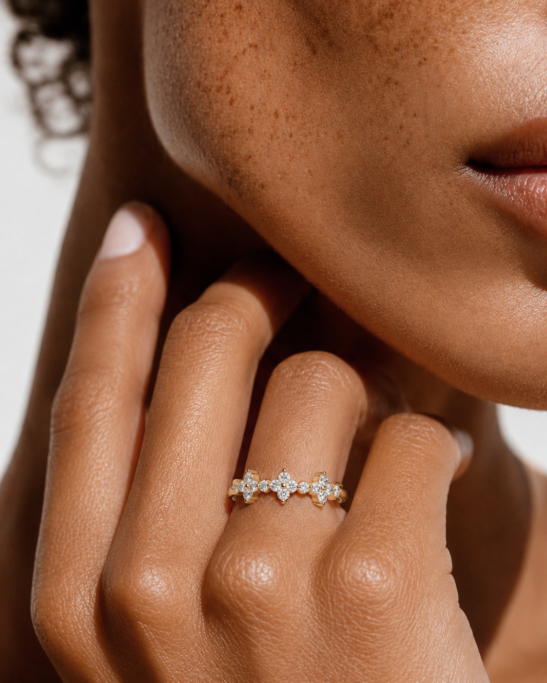 color_10K_YG, color_14K_YG &&Bridal moissanite wedding ring showcasing delicate flower-inspired stone arrangement.