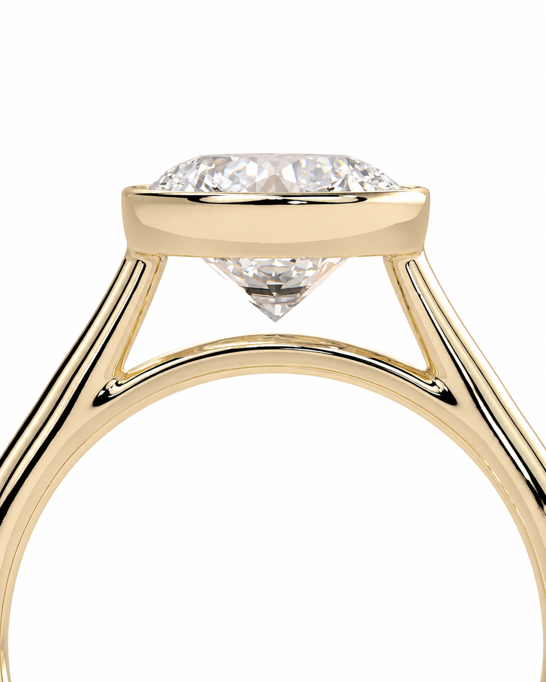 color_10K_YG, color_14K_YG &&A close-up studio shot of a yellow gold solitaire engagement ring with a round brilliant-cut diamond set in a prong setting, on a solid white background.